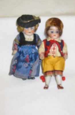 Appraisal: A pair of all bisque dolls house dolls he with