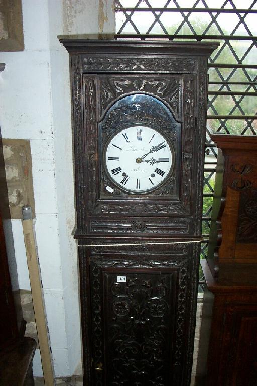 Appraisal: A substantial th century walnut longcase clock with profusely carved