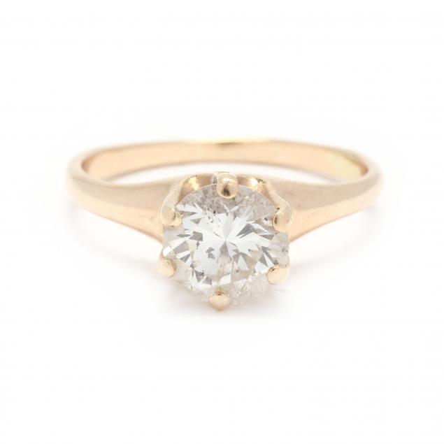 Appraisal: Gold and Diamond Solitaire Ring The round brilliant cut diamond