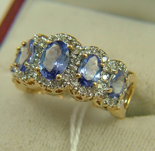 Appraisal: SAPPHIRE DIAMOND AND FOURTEEN KARAT GOLD RING set with five