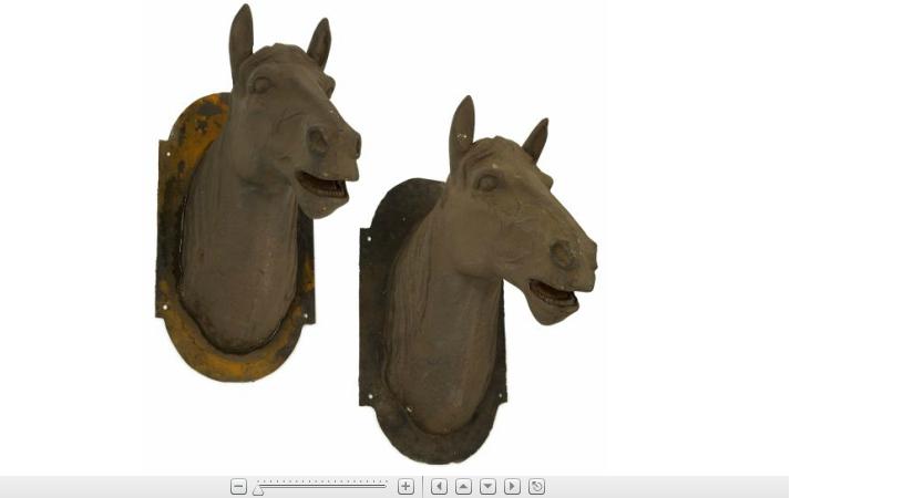 Appraisal: Pair of Victorian style cast iron horse headsafter a model