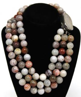 Appraisal: Chinese Triple Strand Agate Bead Necklace Three rows of polished