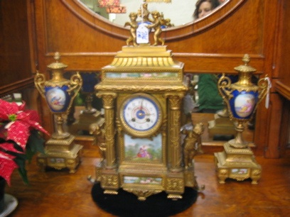 Appraisal: A FRENCH THREE PIECE CLOCK SET IN GILT BRONZE ORMOLU