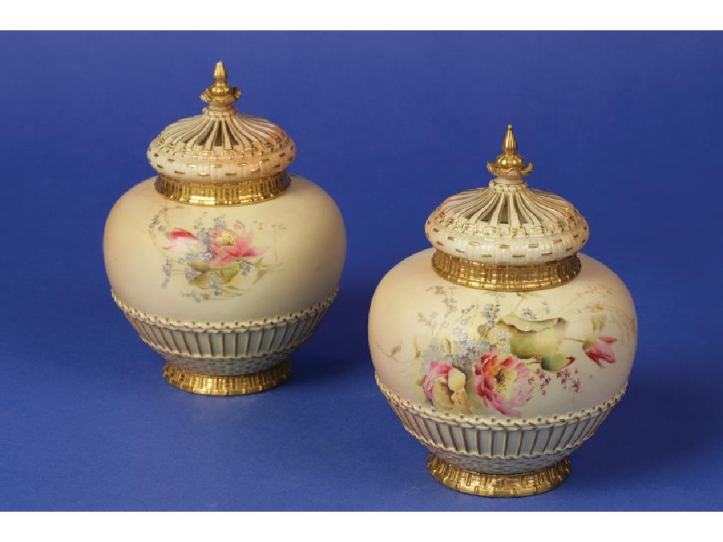 Appraisal: A PAIR OF ROYAL WORCESTER BLUSH IVORY VASES AND COVERS