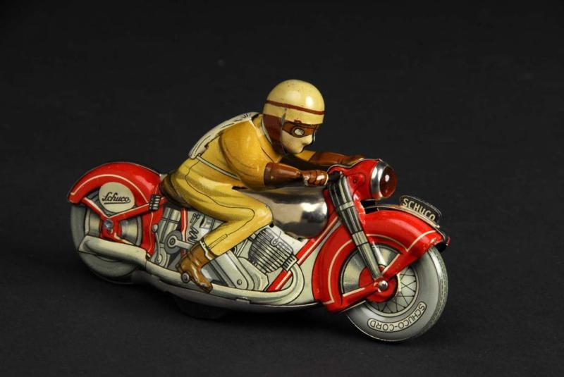 Appraisal: Tin Schuco No Motorcycle Wind-Up Toy Description German Working Marked