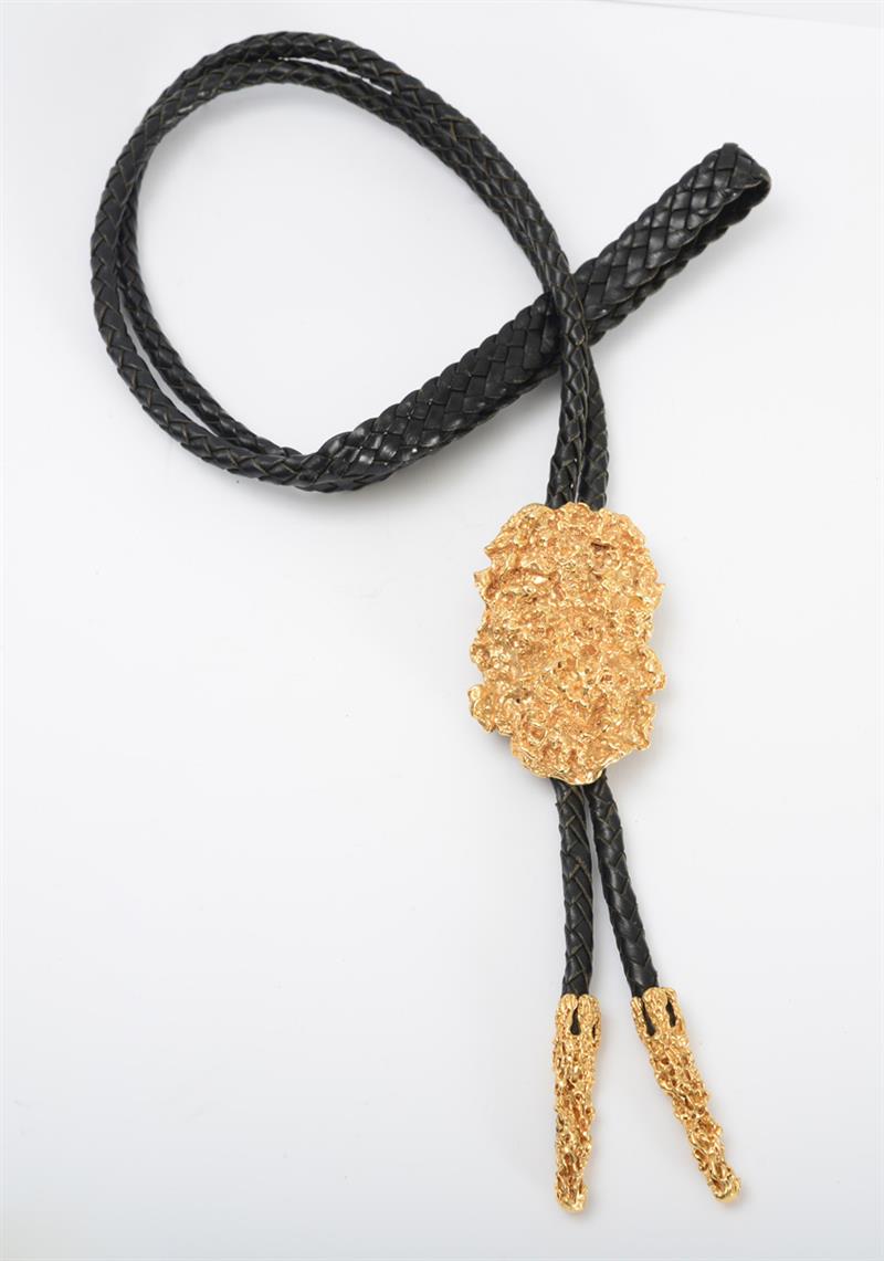 Appraisal: K GOLD BOLO TIE Composed of textured gold signed 'Andrew'