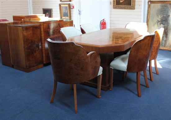 Appraisal: An Art Deco walnut eight piece dining suite comprising of