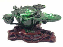 Appraisal: An oriental malachite carving on wooden base