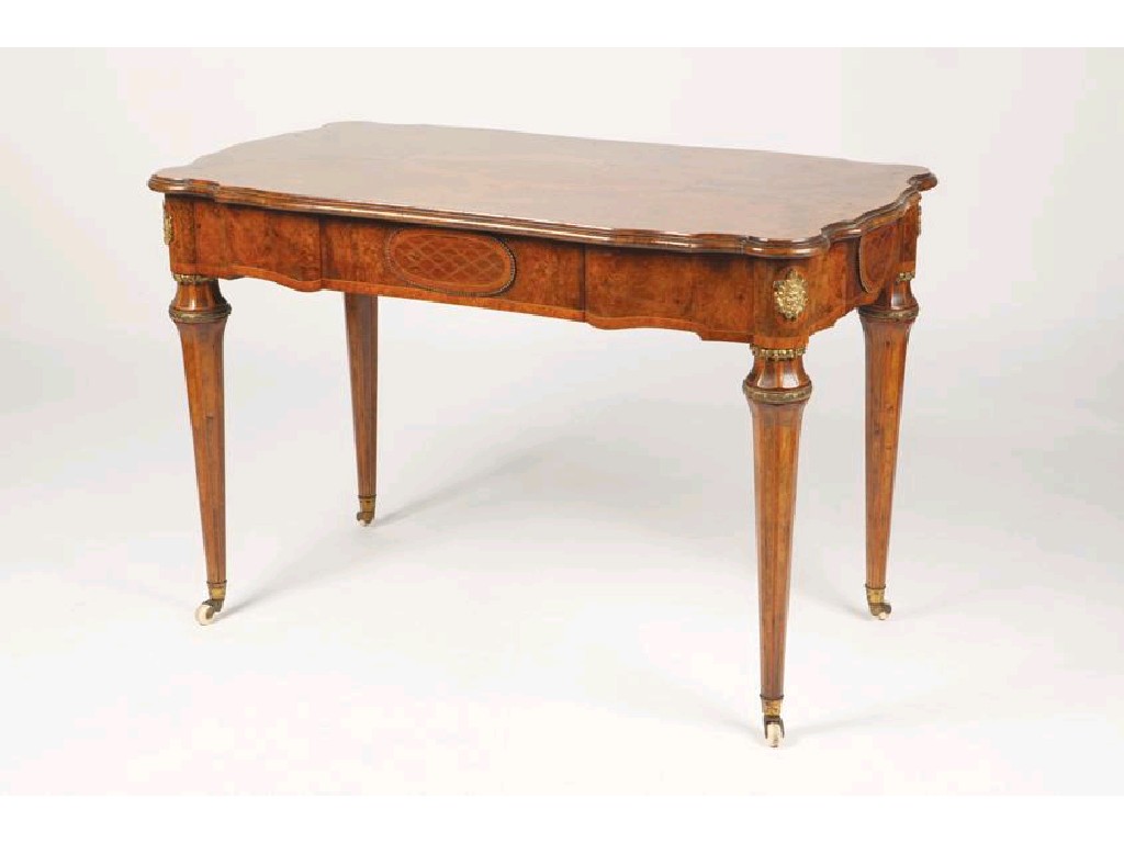 Appraisal: A VICTORIAN BURR-WALNUT AND MARQUETRY CENTRE WRITING TABLE in the