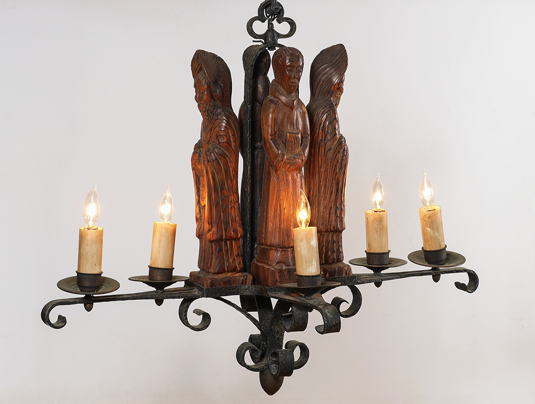 Appraisal: GOTHIC REVIVAL CARVED APOSTLE CHANDELIER Wrought iron arm light chandelier