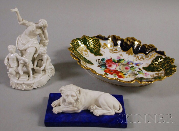 Appraisal: Three Continental Porcelain Articles a KPM porcelain recumbent lion figure