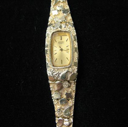 Appraisal: Lady's karat yellow gold Seiko nugget style band wristwatch Weight