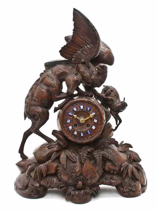 Appraisal: A Black Forest Carved Wood Mantel Clock having a goat