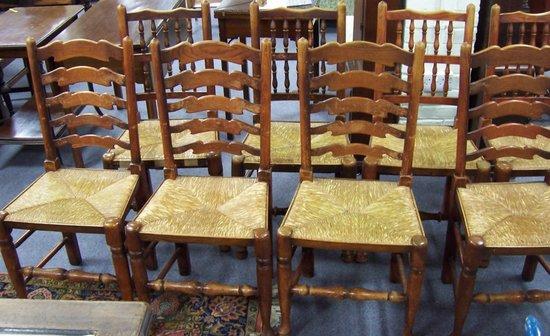 Appraisal: A set of four ladderback chairs with rush seats and