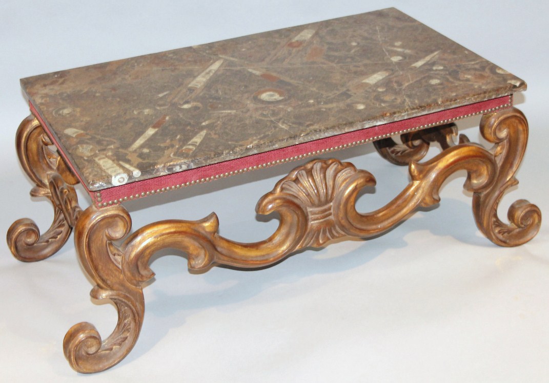 Appraisal: A rococo design gilt wood coffee table with a textured