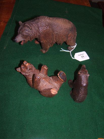 Appraisal: Three small carved Black Forest bears