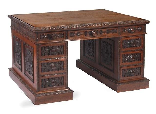 Appraisal: A th Century English oak pedestal desk with carved scrolling