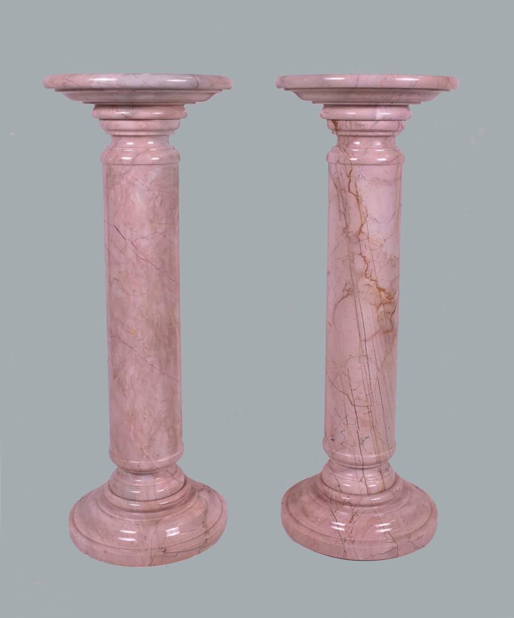 Appraisal: PAIR OF CONTEMPORARY PINK STRIATED COLUMNAR PEDESTALSHeight in Cond good