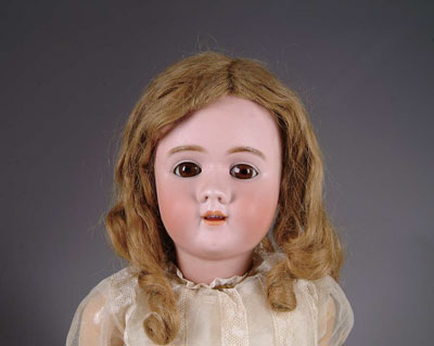 Appraisal: H HANDWERCK Doll has brown glass sleep eyes and is