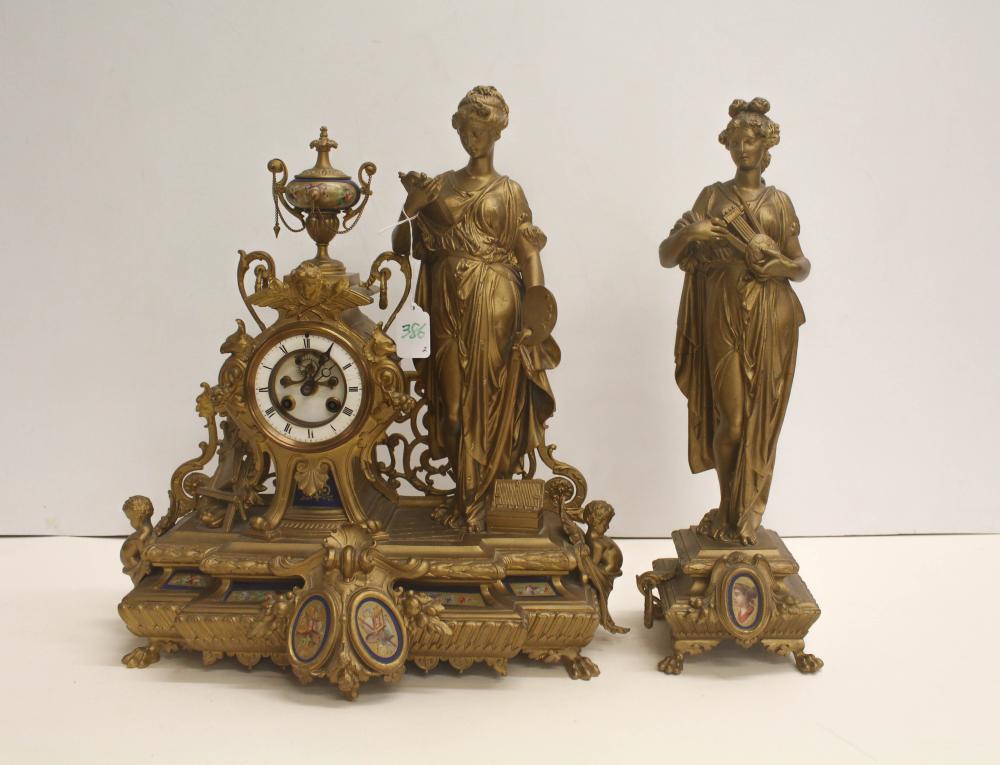 Appraisal: FIGURAL GOLD METAL STATUE CLOCK SET French c the figural