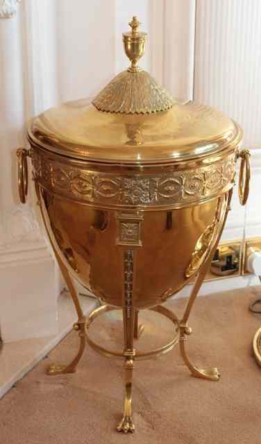 Appraisal: AN EDWARDIAN ADAM STYLE BRASS LIDDED COAL URN with turned