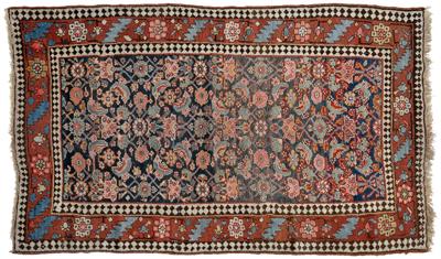 Appraisal: Persian rug repeating floral designs on varying dark blue field