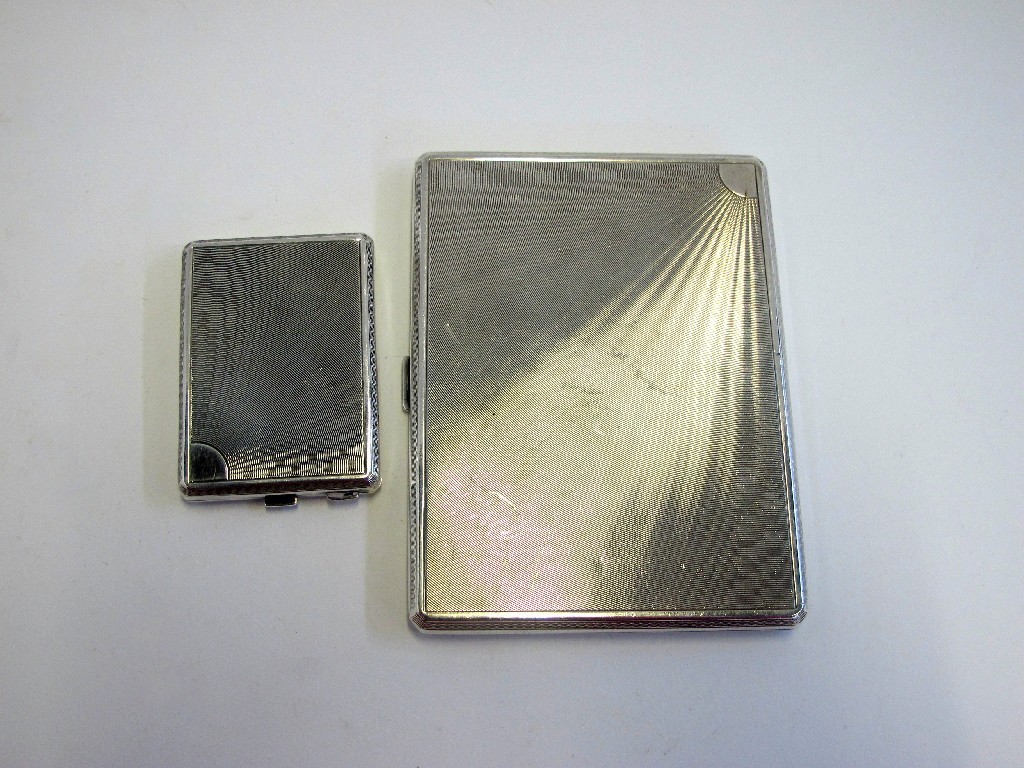 Appraisal: A lot comprising a silver cigarette case and a card