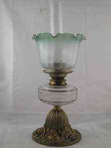 Appraisal: A Victorian oil lamp the facetted glass cistern with brass