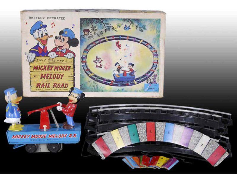 Appraisal: Walt Disney Battery-Operated Mickey Mouse Melody R Description Hand Car