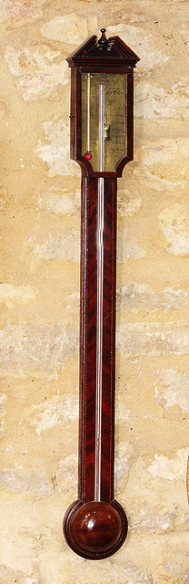 Appraisal: A GEORGE III MAHOGANY STICK BAROMETER the brass dial inscribed