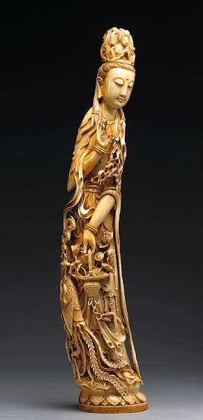 Appraisal: A large pieced and tinted ivory figure of Guanyin First