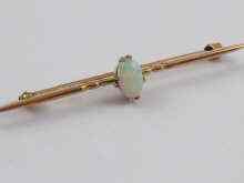 Appraisal: A yellow metal tests ct gold opal bar brooch approx