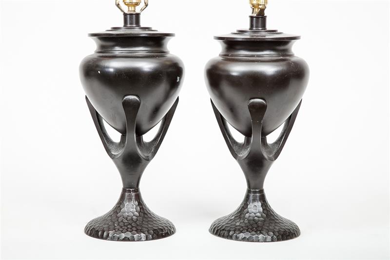 Appraisal: Pair of Black-Patinated Metal Urn Lamps On domed honeycomb bases