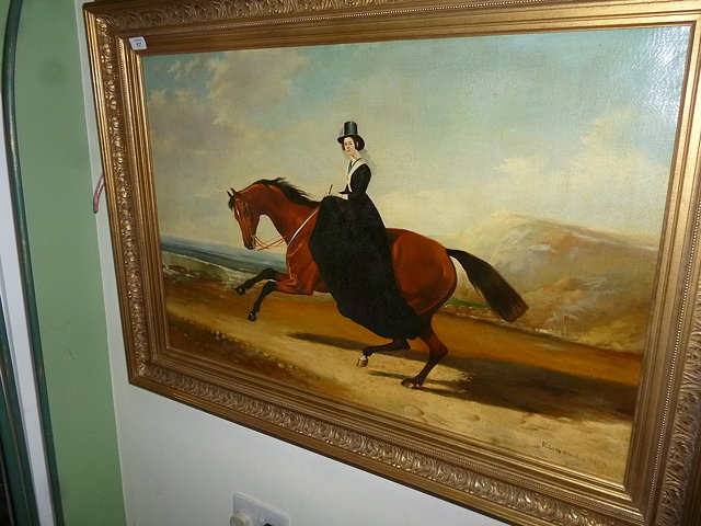 Appraisal: A LADY RIDING A HORSE ALONG A BEACH WITH CLIFFS