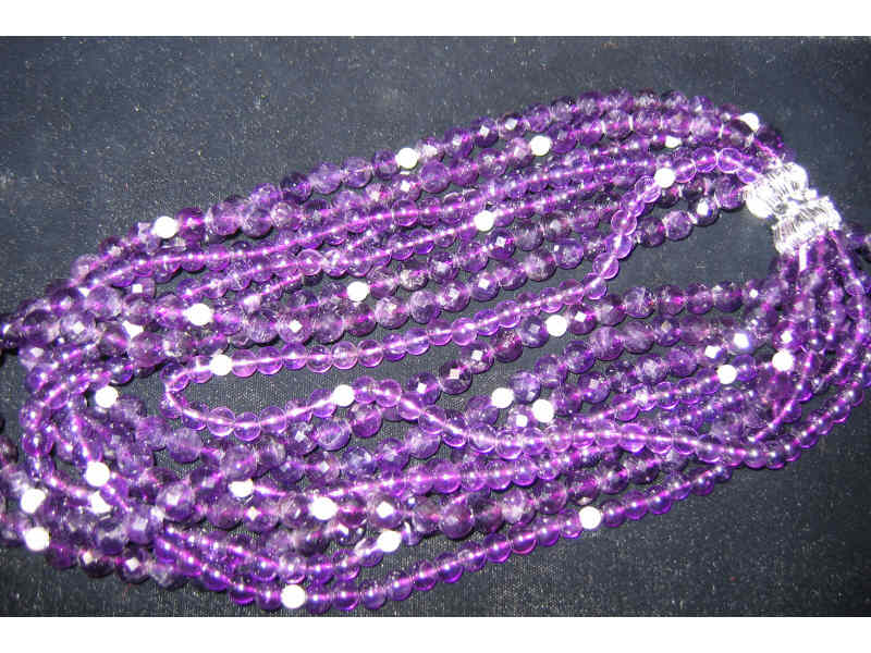 Appraisal: AMETHYST BEADS Seven strand necklace with mm faceted and mm