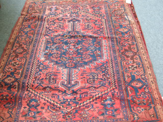 Appraisal: A Hamadan rug Persian the madder field with a dark