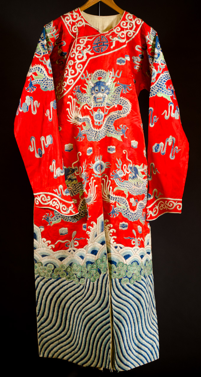 Appraisal: CHINESE EMBROIDERED RED SILK COURT ROBE featuring dragons and small