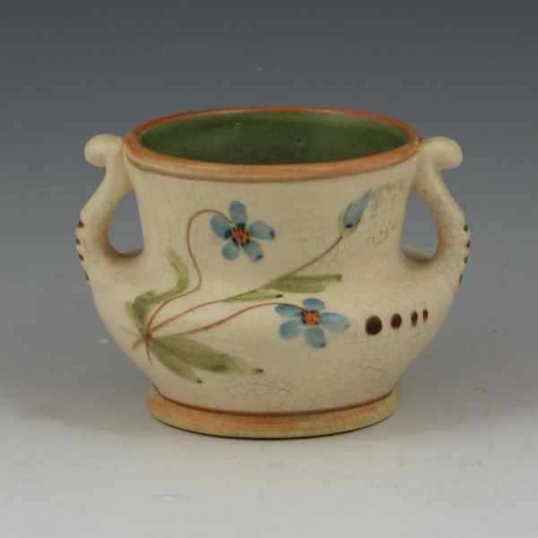 Appraisal: Weller Bonito handled vase with floral design Marked Weller Pottery