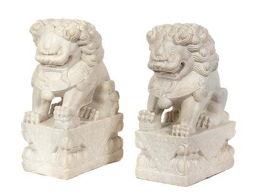 Appraisal: A Pair of Chinese Carved White Marble Foo Lions Height