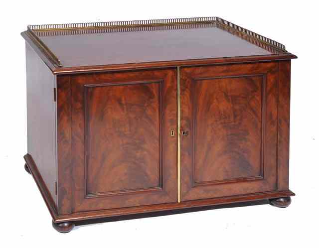 Appraisal: A TH CENTURY MAHOGANY COLLECTORS CABINET the interior fitted fourteen