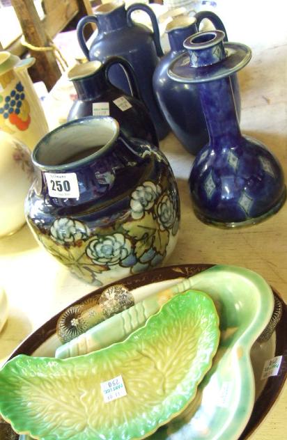 Appraisal: Three Royal Doulton stoneware jugs decorated in the blue glaze