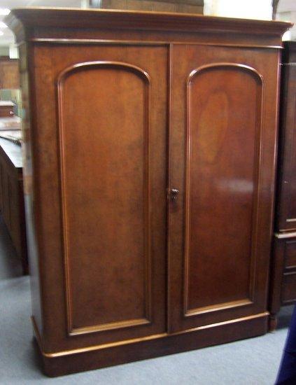 Appraisal: A Victorian mahogany wardrobe enclosed by a pair of fielded