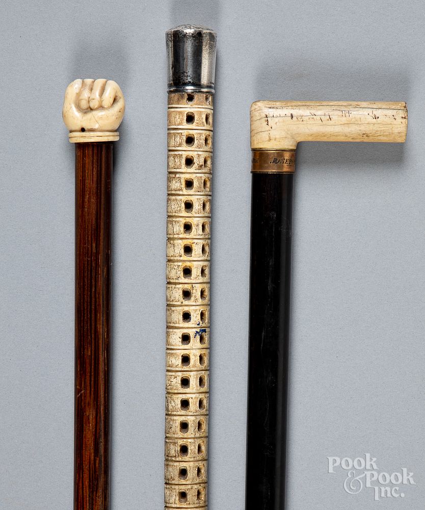 Appraisal: Three canes walking sticks th c Three canes walking sticks