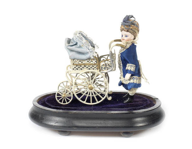 Appraisal: Miniature all-bisque doll with pram under glass dome With fixed