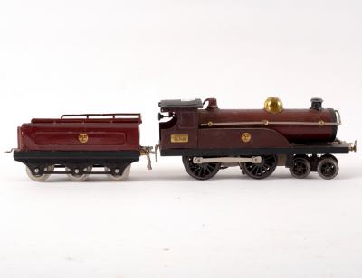 Appraisal: A Hornby clockwork -gauge MCL locomotive and tender brown painted