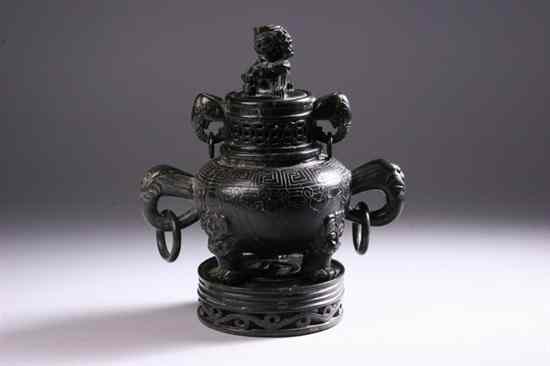 Appraisal: CHINESE SOAPSTONE TRIPOD CENSER Carved of dark grey stone with