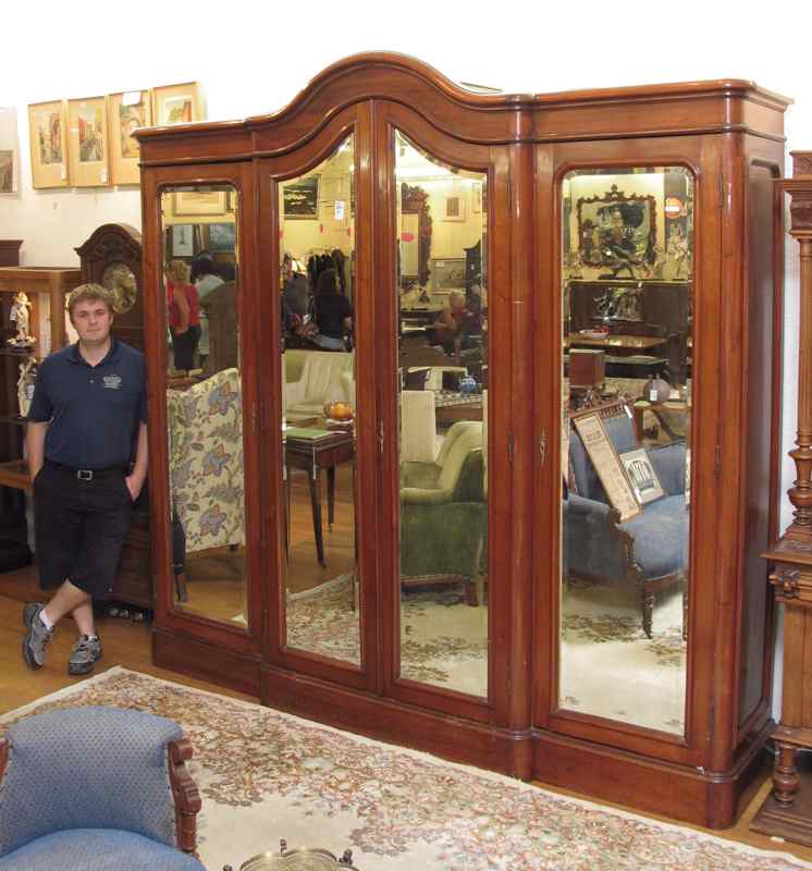 Appraisal: MONUMENTAL DOOR FRENCH ARMOIRE With beveled glass mirrored doors Measures