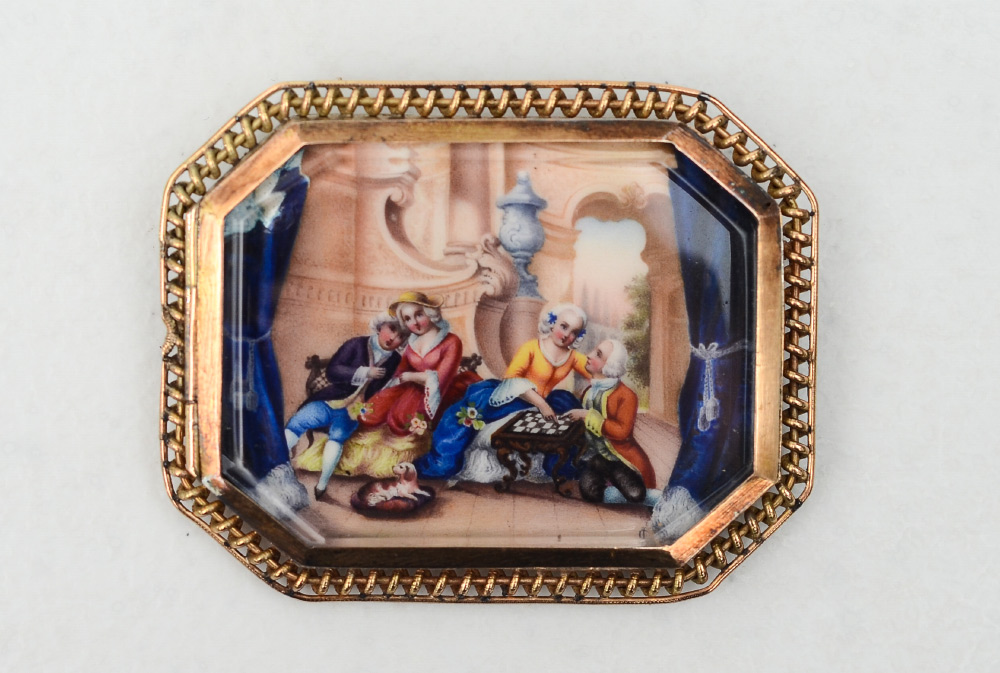 Appraisal: ANTIQUE PAINTING BROOCH A familial scene painted on metal and