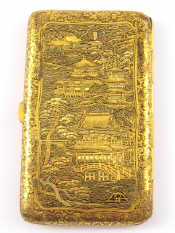 Appraisal: A Japanese gilt metal cigarette case engraved with Oriental scenes