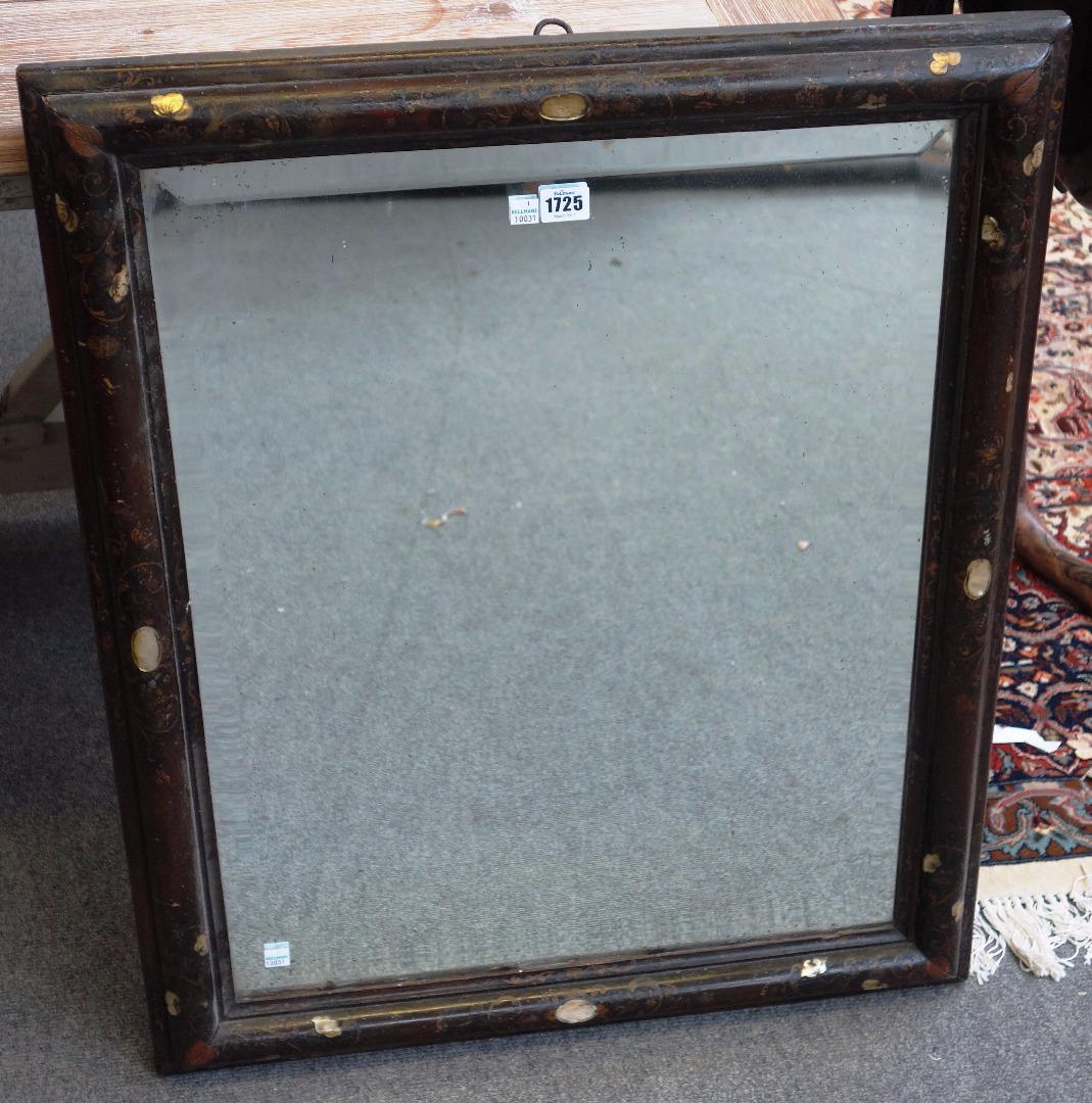 Appraisal: An th century black lacquer mother-of-pearl inlaid rectangular wall mirror